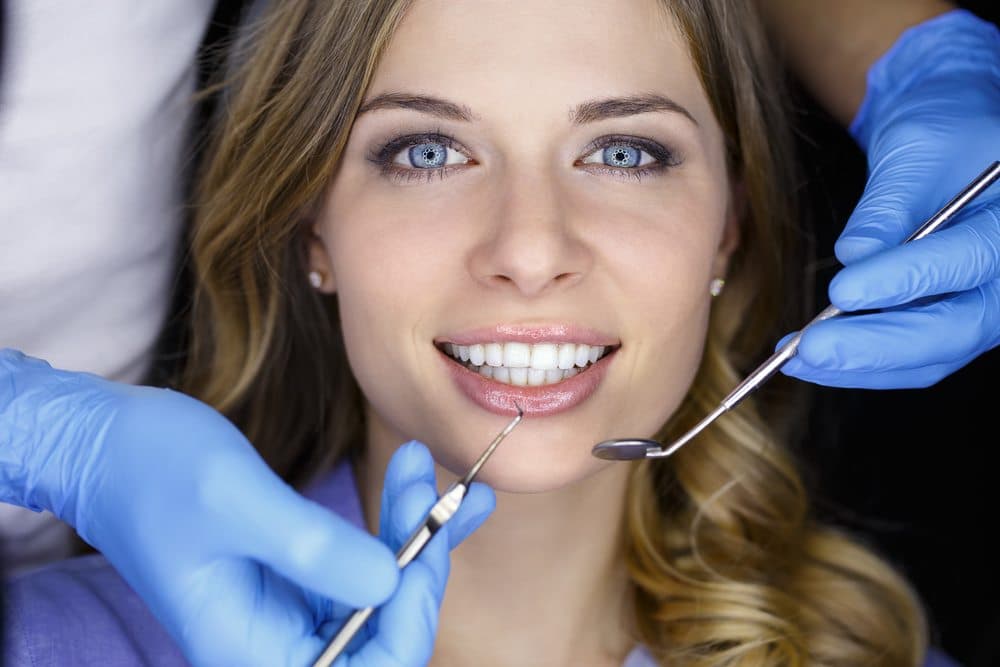 female patient about to receive dental treatment